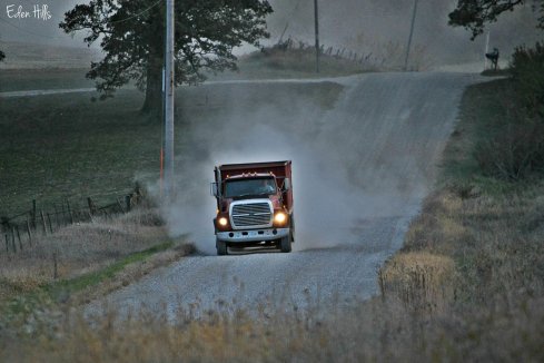 grain truck on gravel road